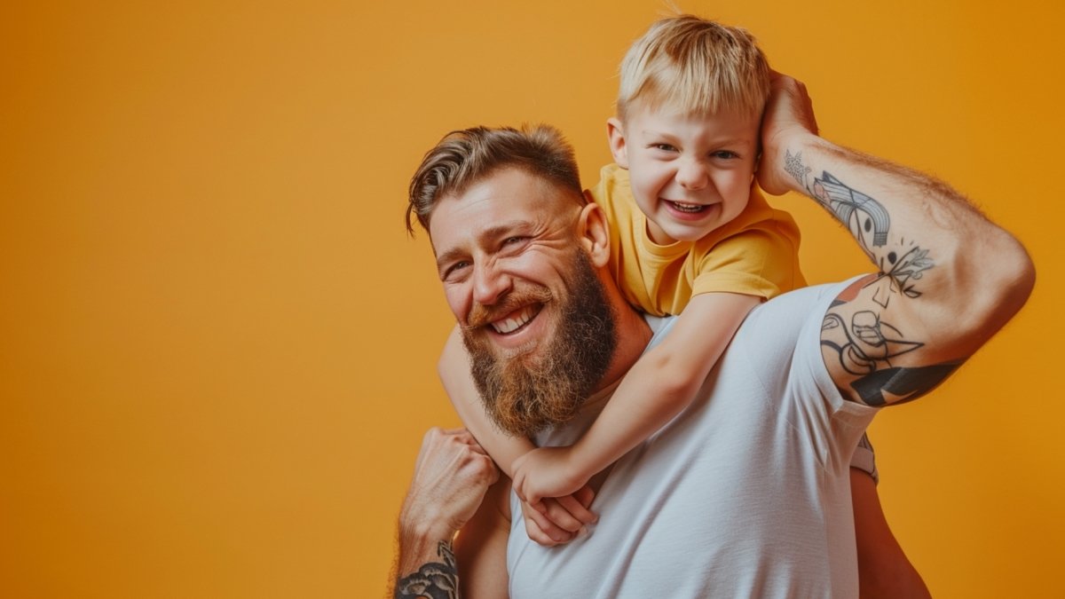 a man playfully lifting his kid on the back