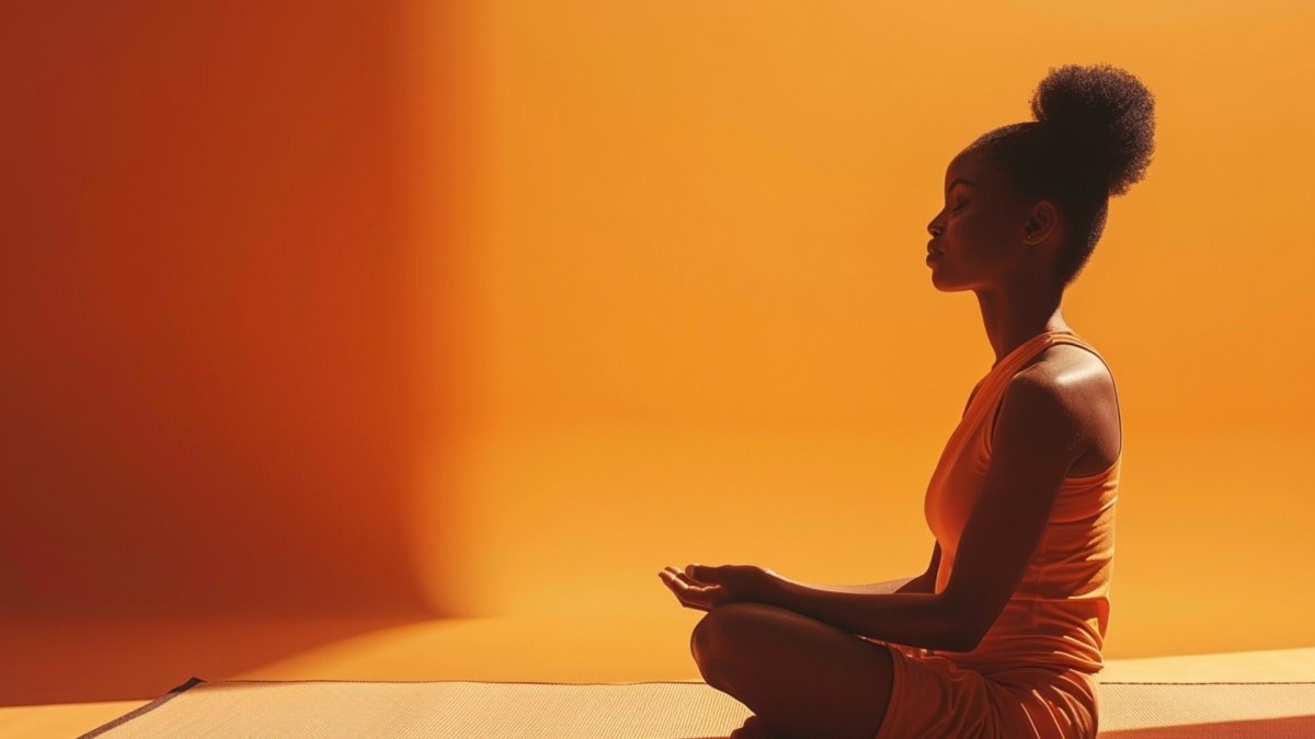 A woman sitting on a mat doing inner work