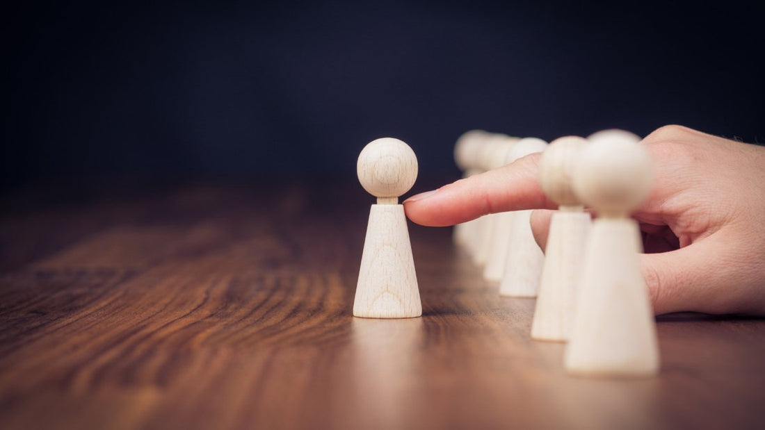 piece of wood like a chess piece being pushed on the side out of its comfort zone