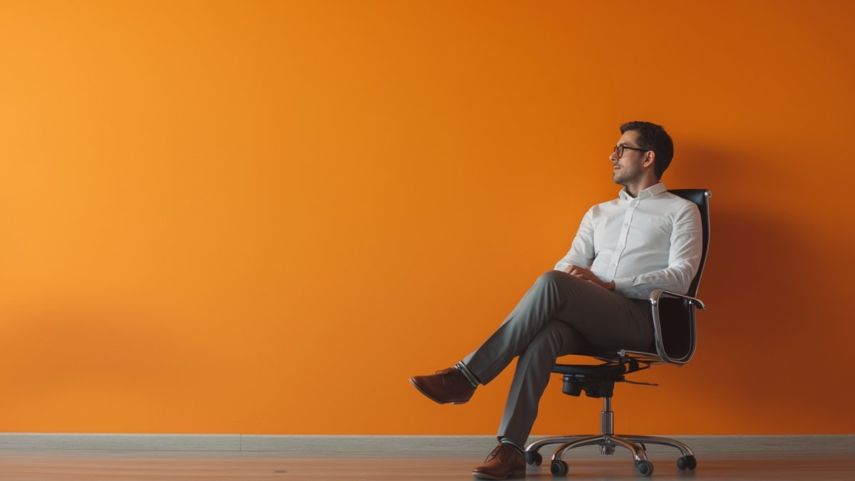 Man sitting on a chair in office taking a break on Thursday afternoon