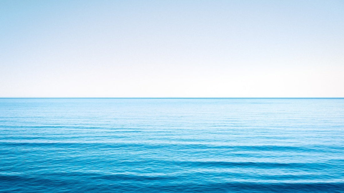 ocean still water, blue sky