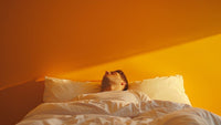 A man manifesting his dreams while sleeping using Pillow method