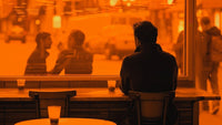 Man sitting in a coffee shop alone wondering 'Why Am I Single?'