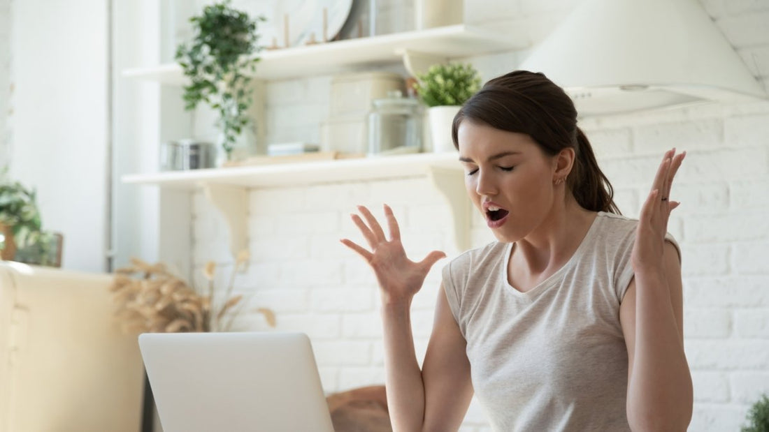 woman frustrated and impatient in from of her laptop