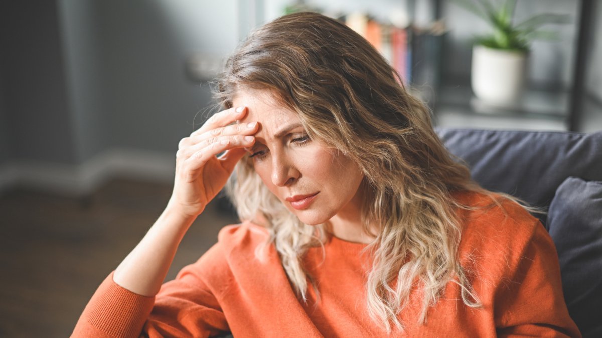 woman suffering from over resilience holding her head worried stressed