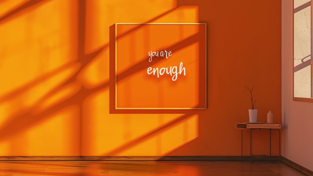 "You are Enough" quote frame hanging on the wall in a room